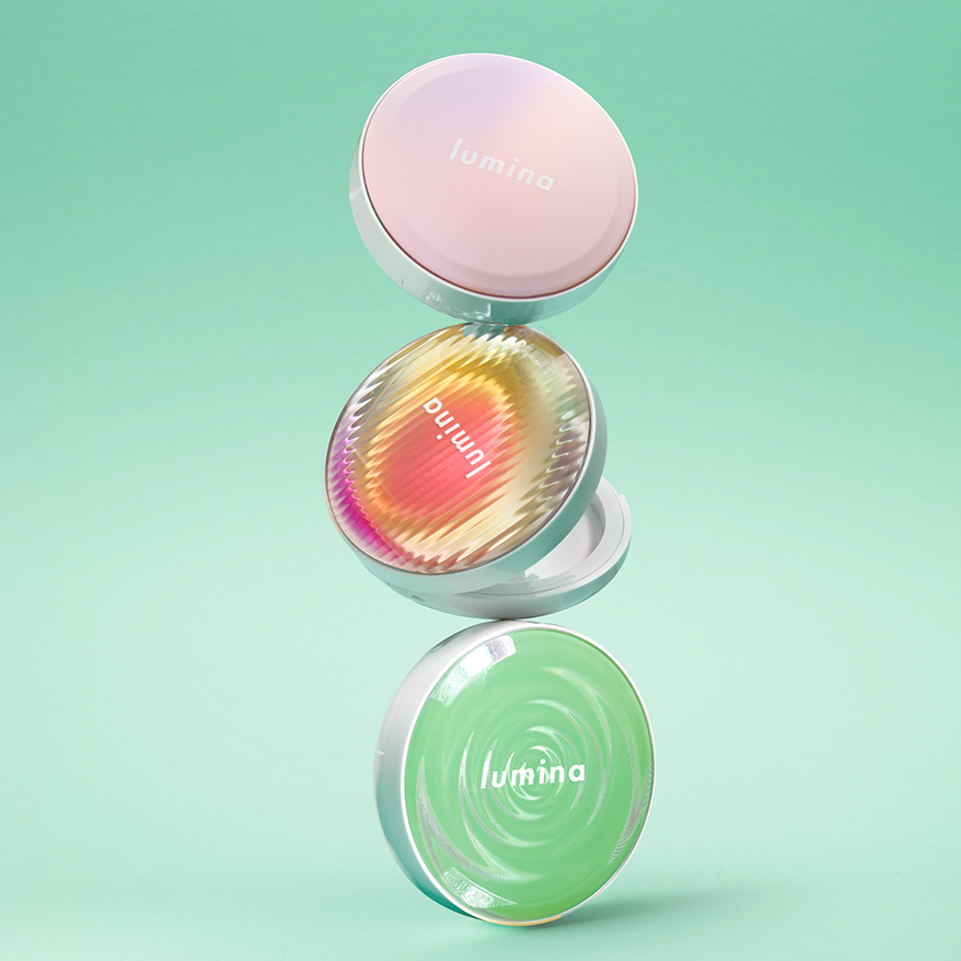 HCP Lumina trend packaging – trio of Radii Round Pressed Powder compacts with iridescent, pastel and optical-effect top-plates on a mint green background