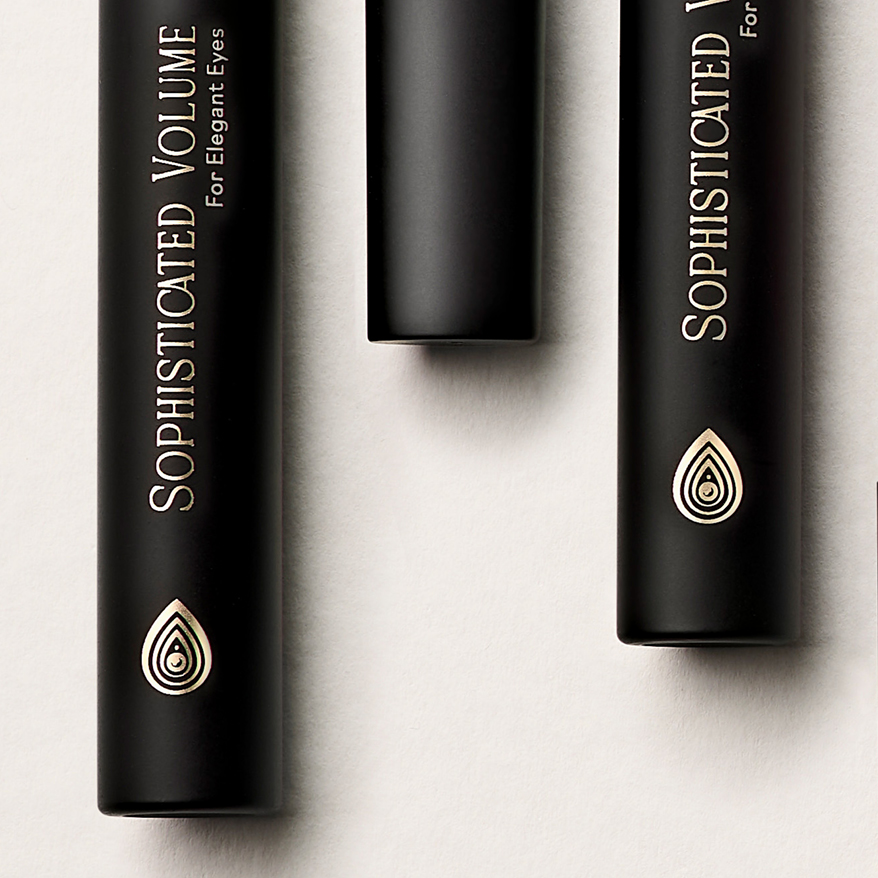 Close-up of hot foil stamping detail on mascara packaging, showcasing premium metallic branding and precise decorative finishing.